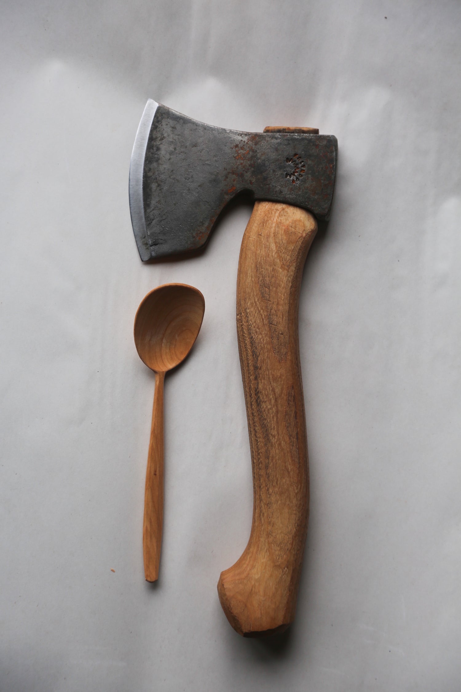 A julia kalthoff carving axe and a hand carved cherry eating spoon